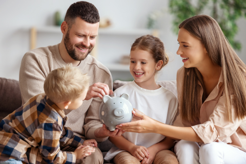 Family with piggy bank